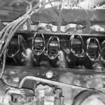 Close up view of the cylinder heads on a vintage 1987 RV engine during a mechanical repair in the desert.
