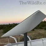Starlink satellite dish mounted on an RV roof during a desert sunset, providing remote work internet for digital nomads
