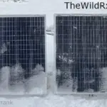 Pair of solar panels with snow.