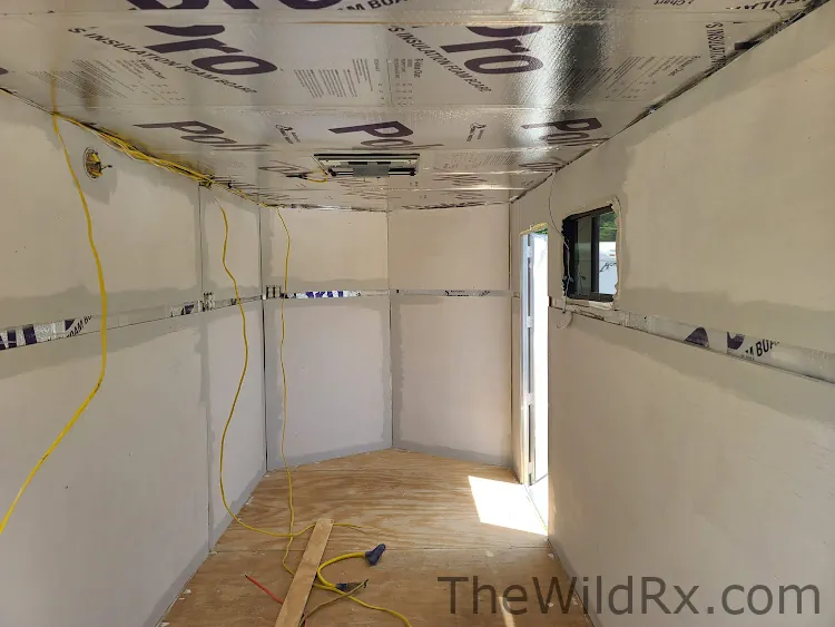Picture of a trailer under construction with reflective sided foamboard insulation